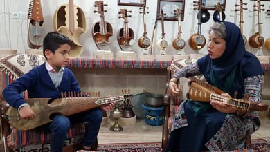 The Art Of Crafting And Playing Rubab Listed As Unesco Heritage 5 A Female Rubab Master Teaches Her Young Student The Intricate Art Of Fretting And Plucking Preserving The Timeless Craft Of Traditional Music Photo By Shahab Nikman