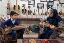 A Female Rubab Master Teaches Her Young Student The Intricate Art Of Fretting And Plucking Preserving The Timeless Craft Of Traditional Music Photo By Shahab Nikman