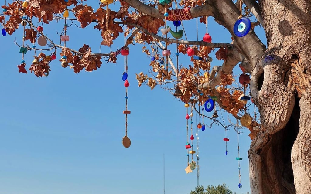 Nazar Amulets Hang From A Tree In Iran, Believed To Protect Against The Evil Eye. Shinyoung Park / Alamy