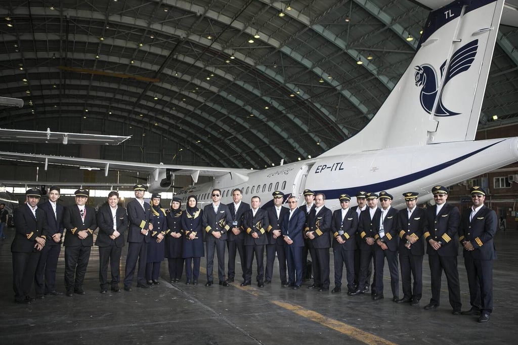 Crew Members Of Iran Air Pose For Group Photo Beside An Atr At Mehrabad Airport In Tehran