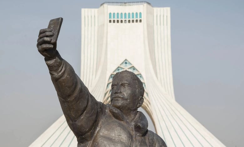 Taking A Selfie With Phone Sculpture, Azadi Tower At Background