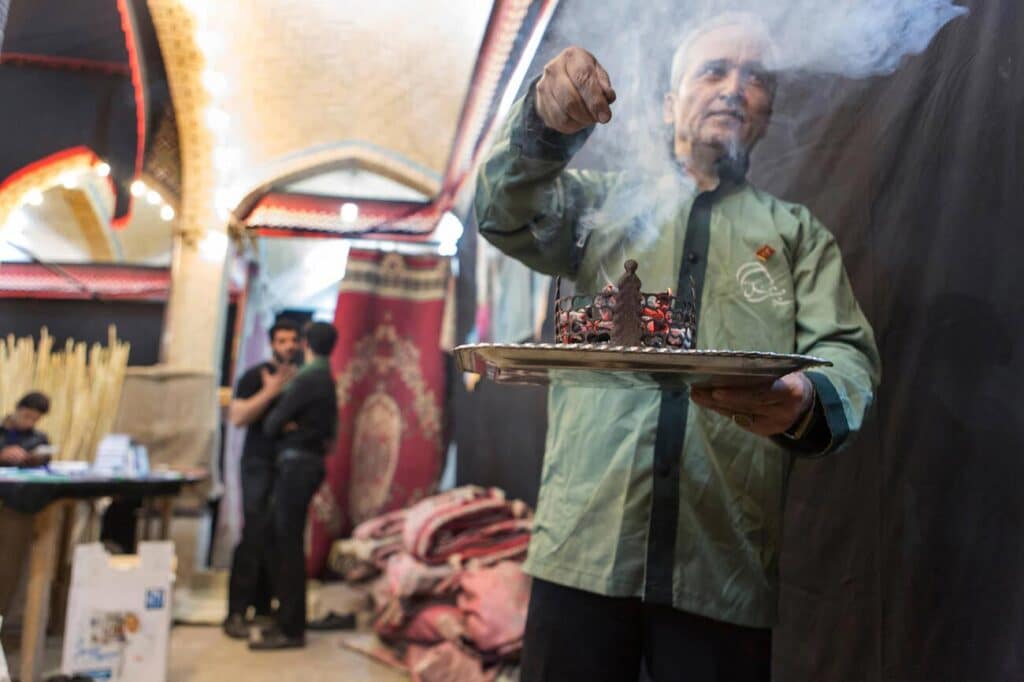 A Man Burns Esfand In A Hosseinieh In Kashan During Moharram