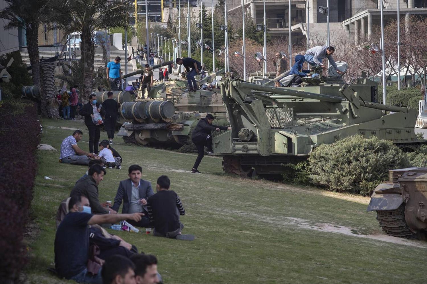 People By Tanks At The Museum Of Islamic Revolution And Holy Defense