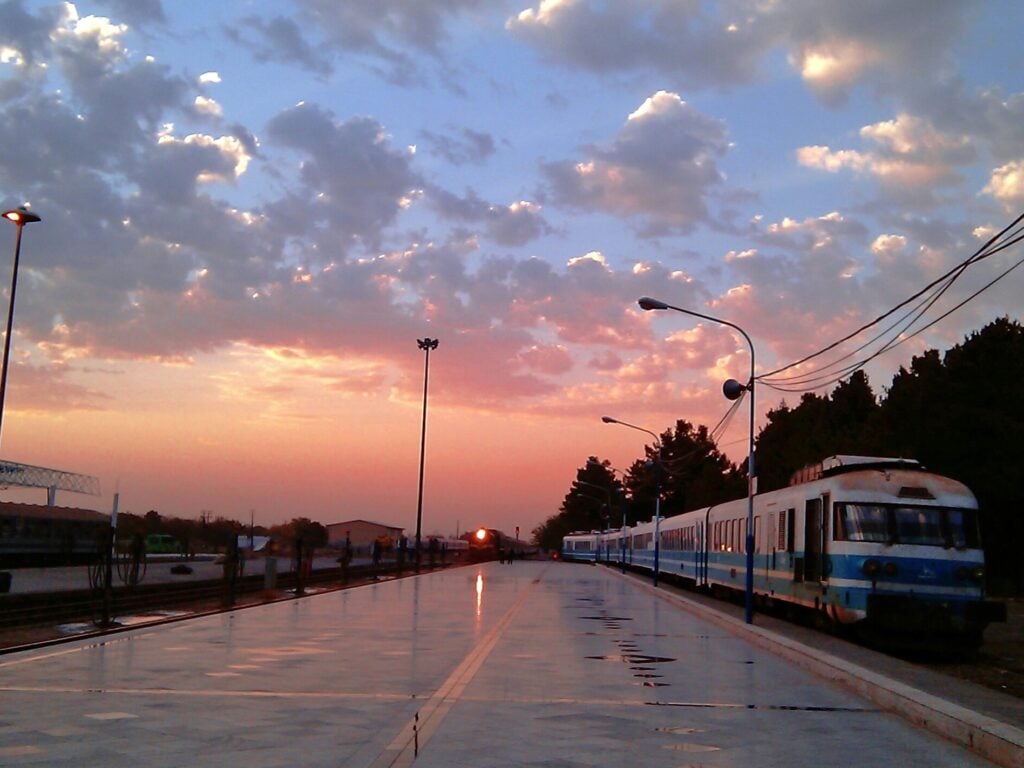 A Beautiful Sunset Among The Trains On The Tracks At Mashhad Railway Station