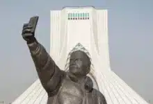 Taking A Selfie With Phone Sculpture, Azadi Tower At Background