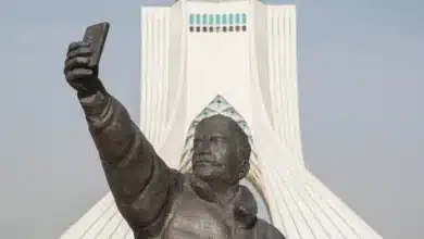 Taking A Selfie With Phone Sculpture, Azadi Tower At Background