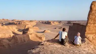 Tourists Watch The Sun Go Down Over Yardangs In The Lut Desert In Shahad, Ian