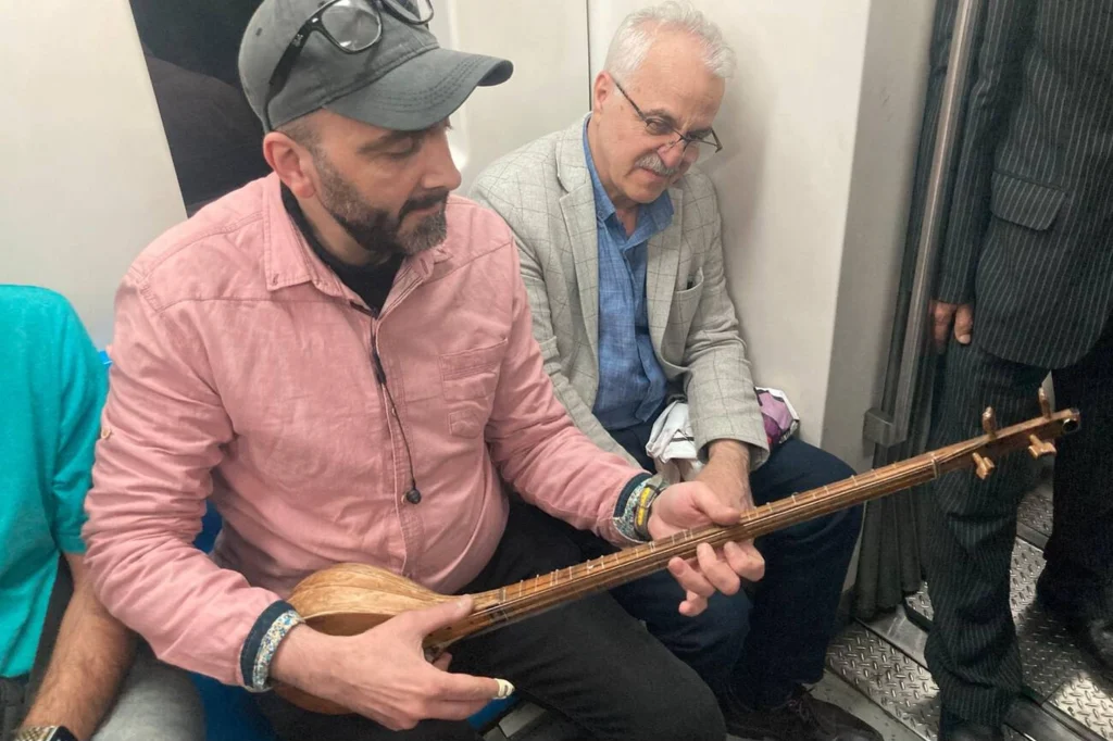 Iranian Street Musician Playing Setar In Tehran Metro