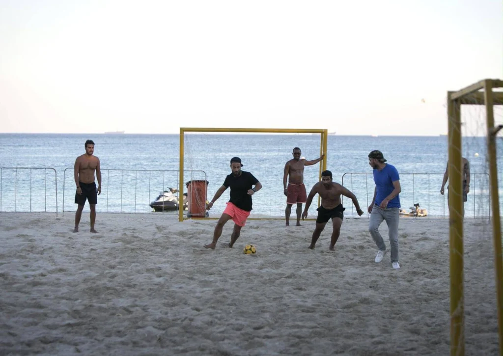 People Play Football On The Beach In Kish Island, Southern Iran
